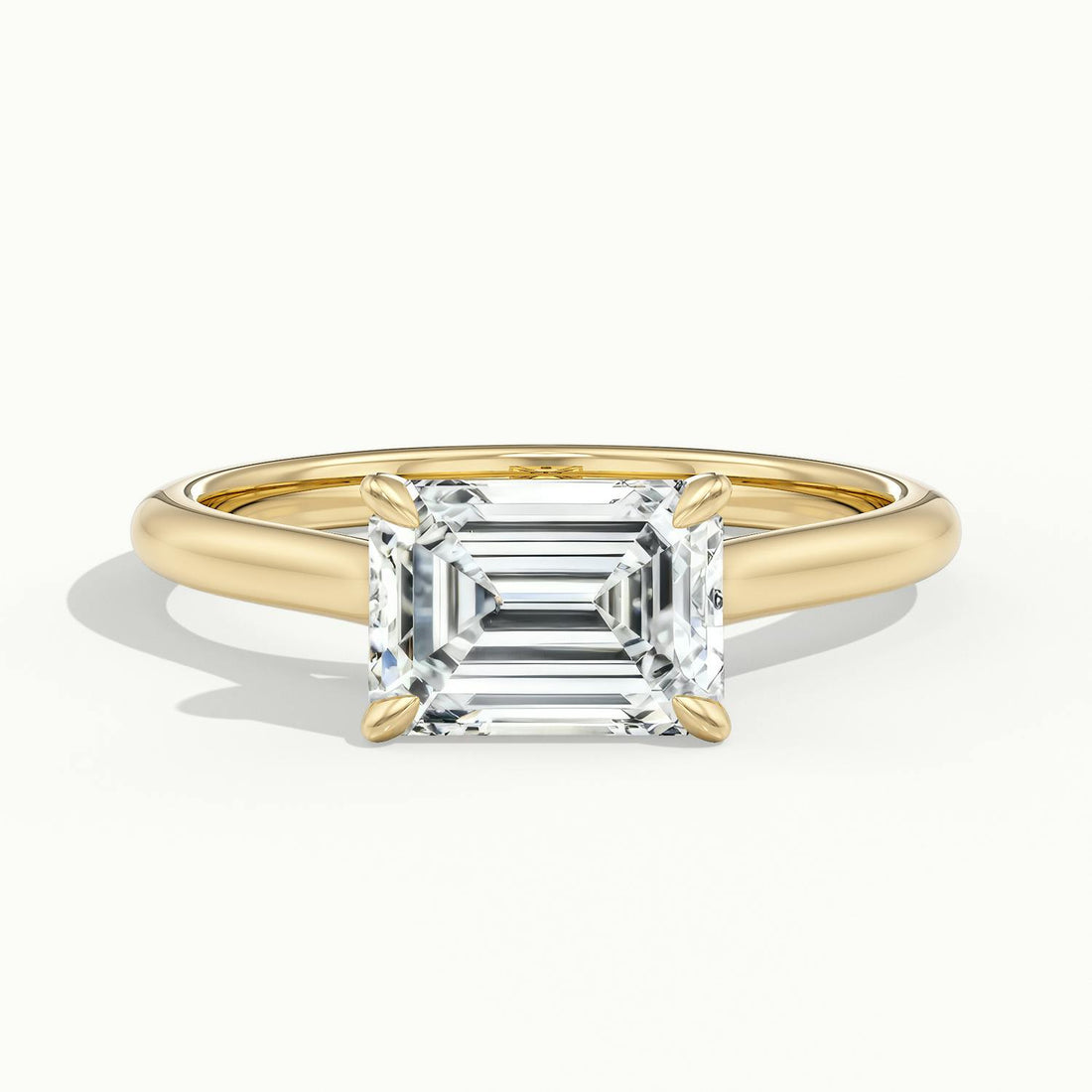 Lucienne East to West Emerald Solitaire Engagement Ring