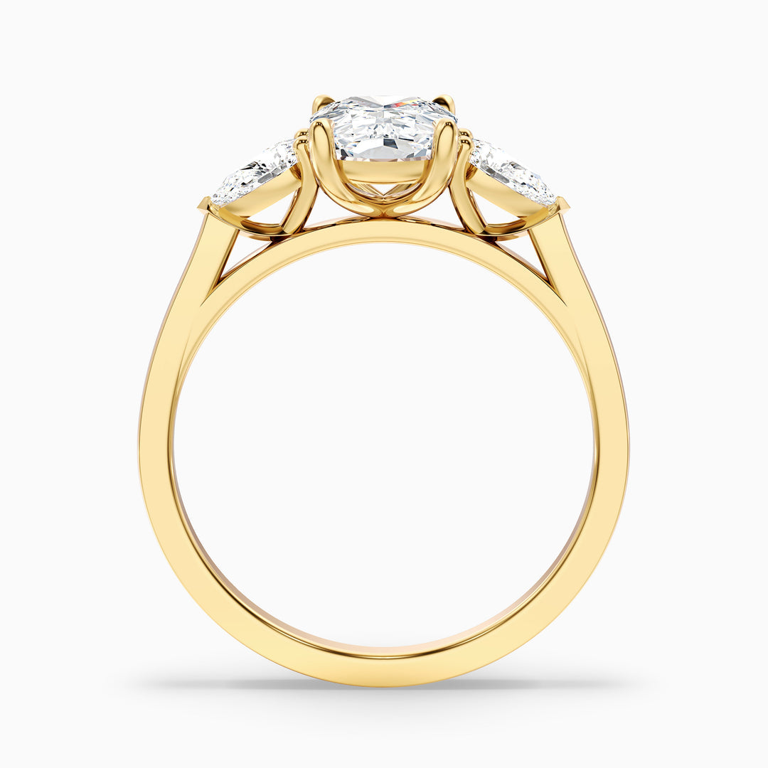 Jarl Three Stone Ring with Pear Side Stones and an Elongated Cushion Lab Grown Diamond