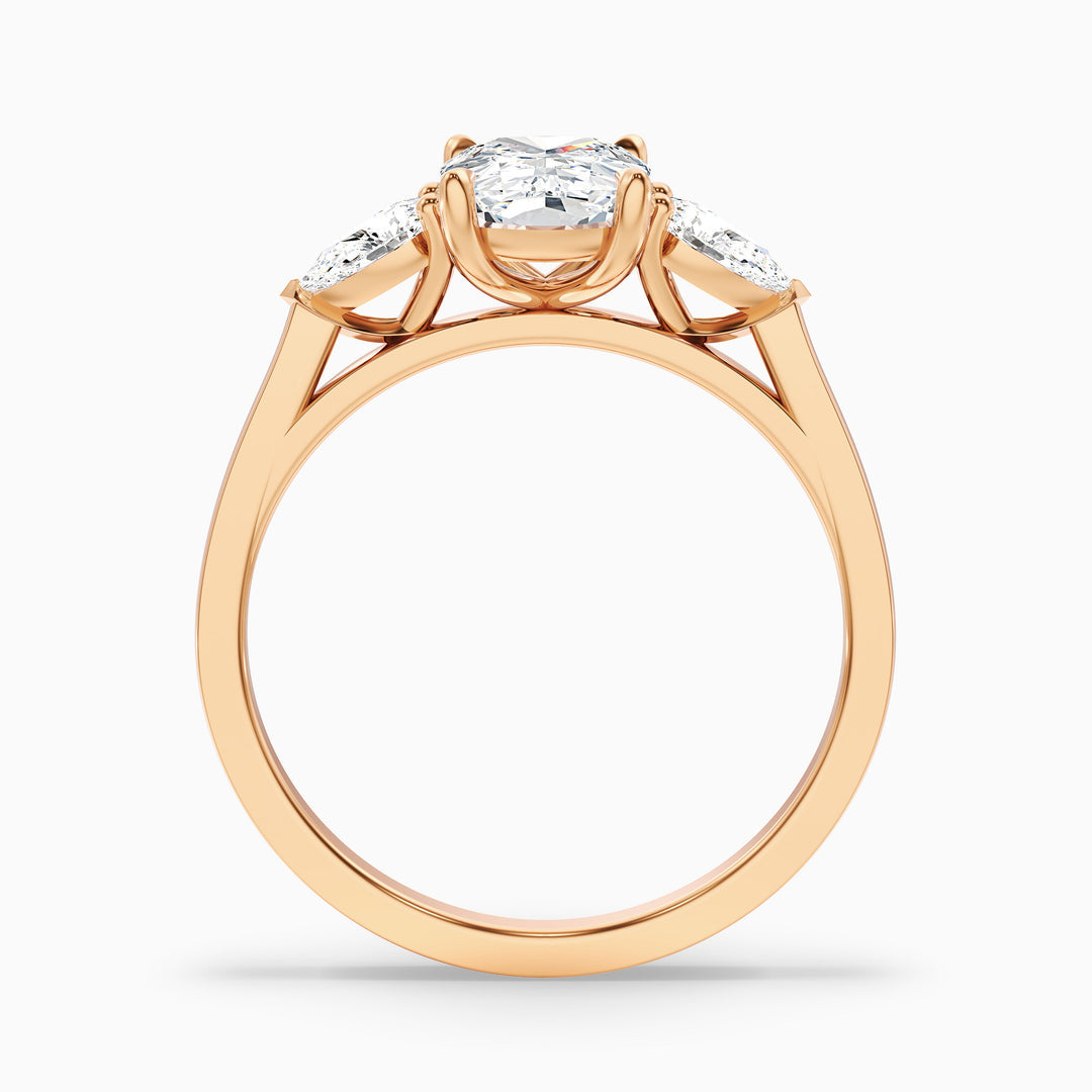 Jarl Three Stone Ring with Pear Side Stones and an Elongated Cushion Lab Grown Diamond