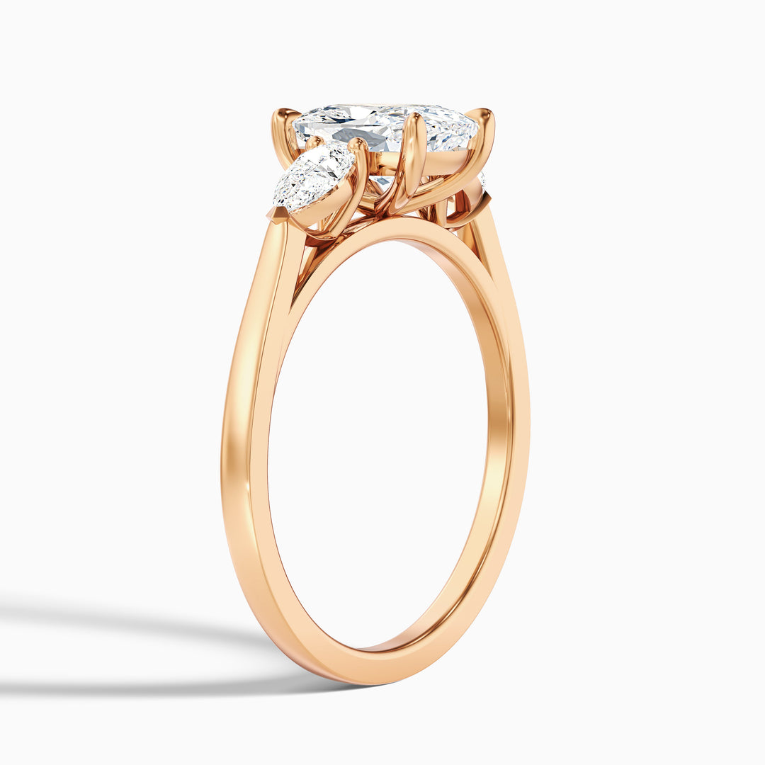 Jarl Three Stone Ring with Pear Side Stones and an Elongated Cushion Lab Grown Diamond