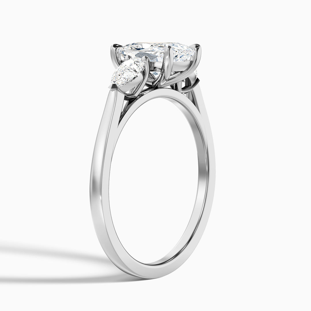 Jarl Three Stone Ring with Pear Side Stones and an Elongated Cushion Lab Grown Diamond