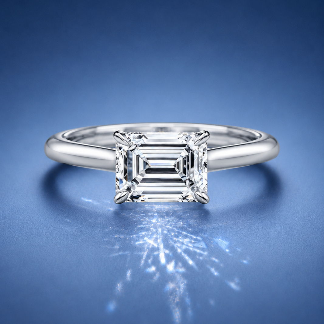 Lucienne East to West Emerald Solitaire Engagement Ring