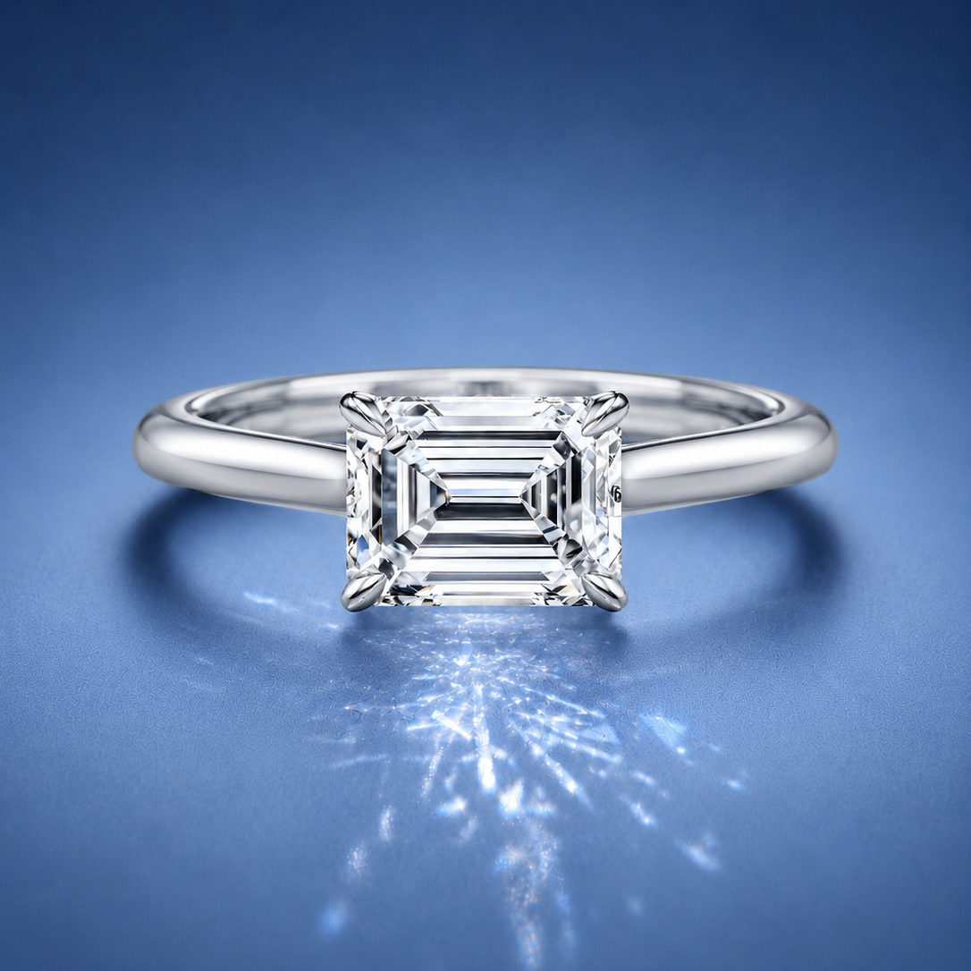 Lucienne East to West Emerald Solitaire Engagement Ring