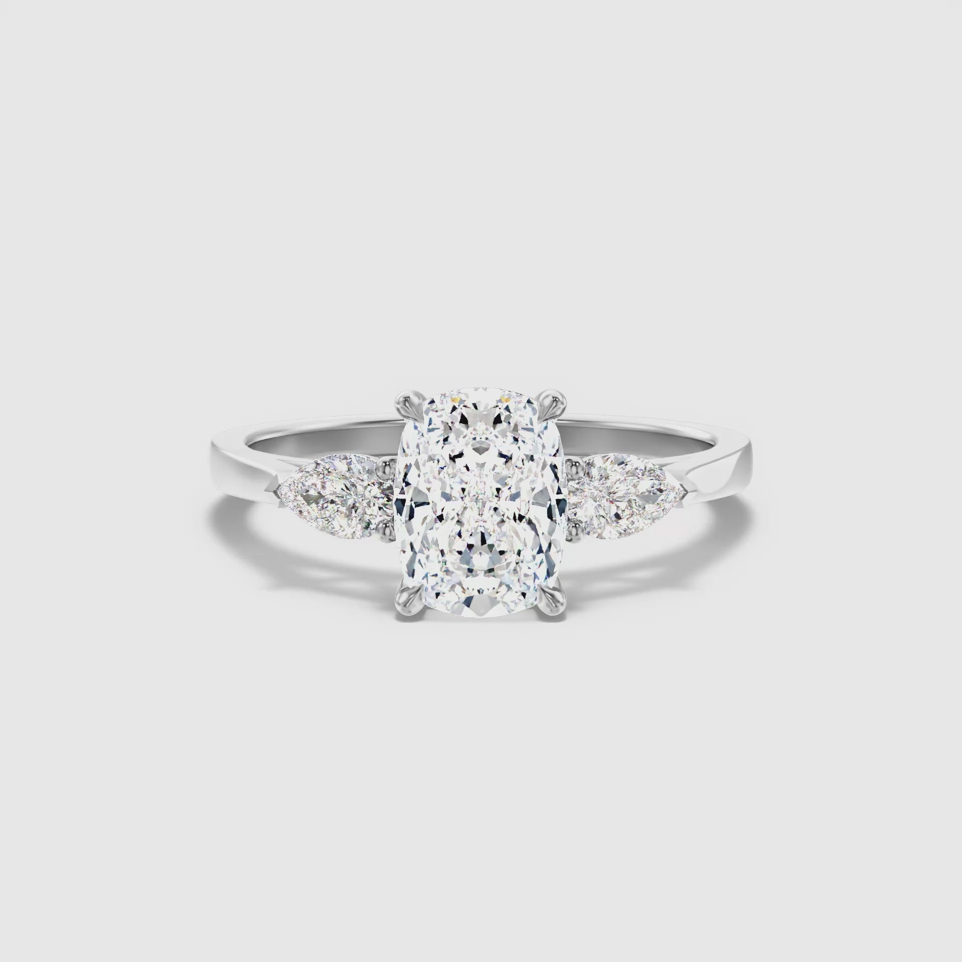 Jarl Three Stone Ring with Pear Side Stones and an Elongated Cushion Lab Grown Diamond